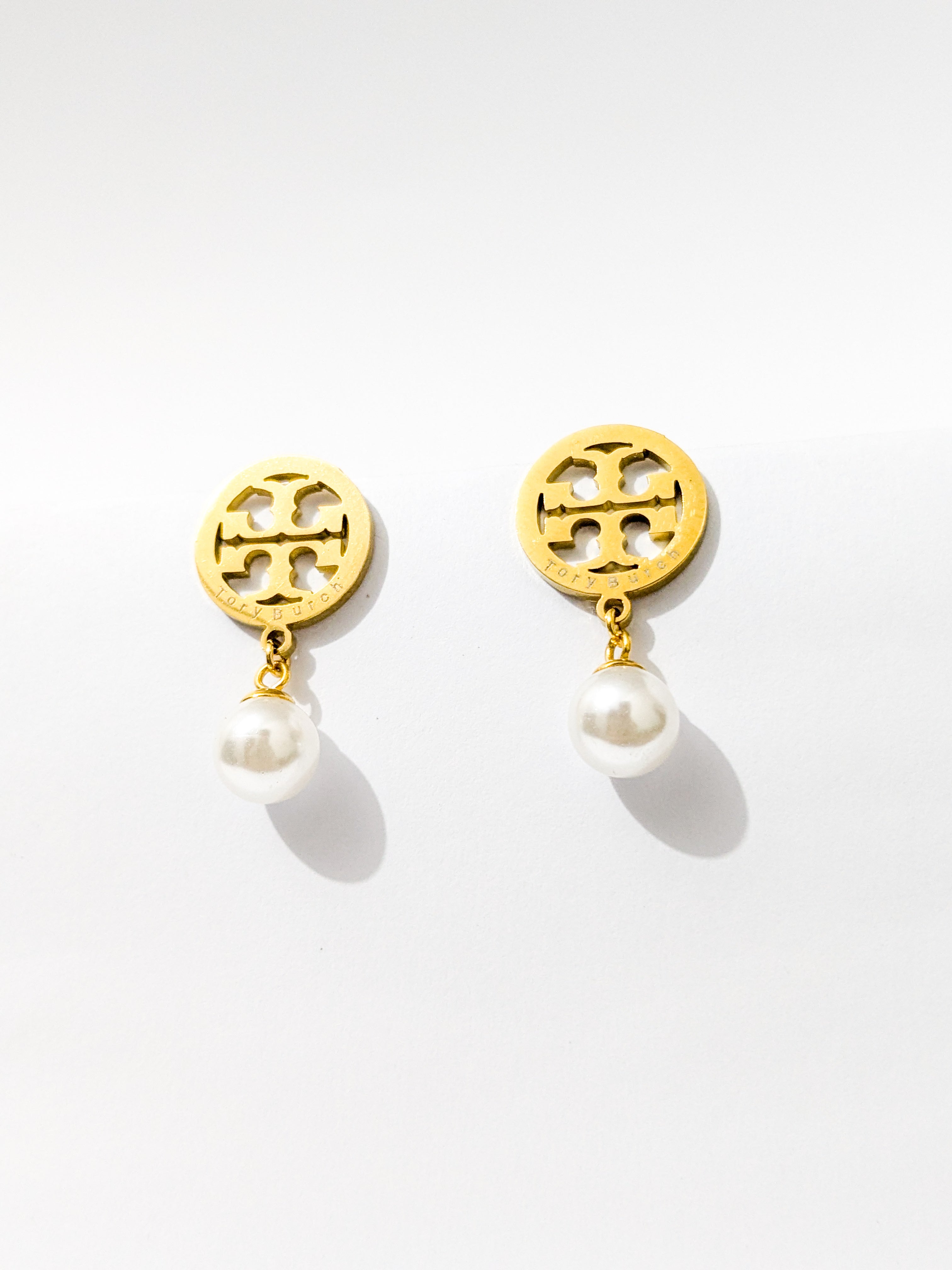 A Pair of Tory Burch pearl drop earrings