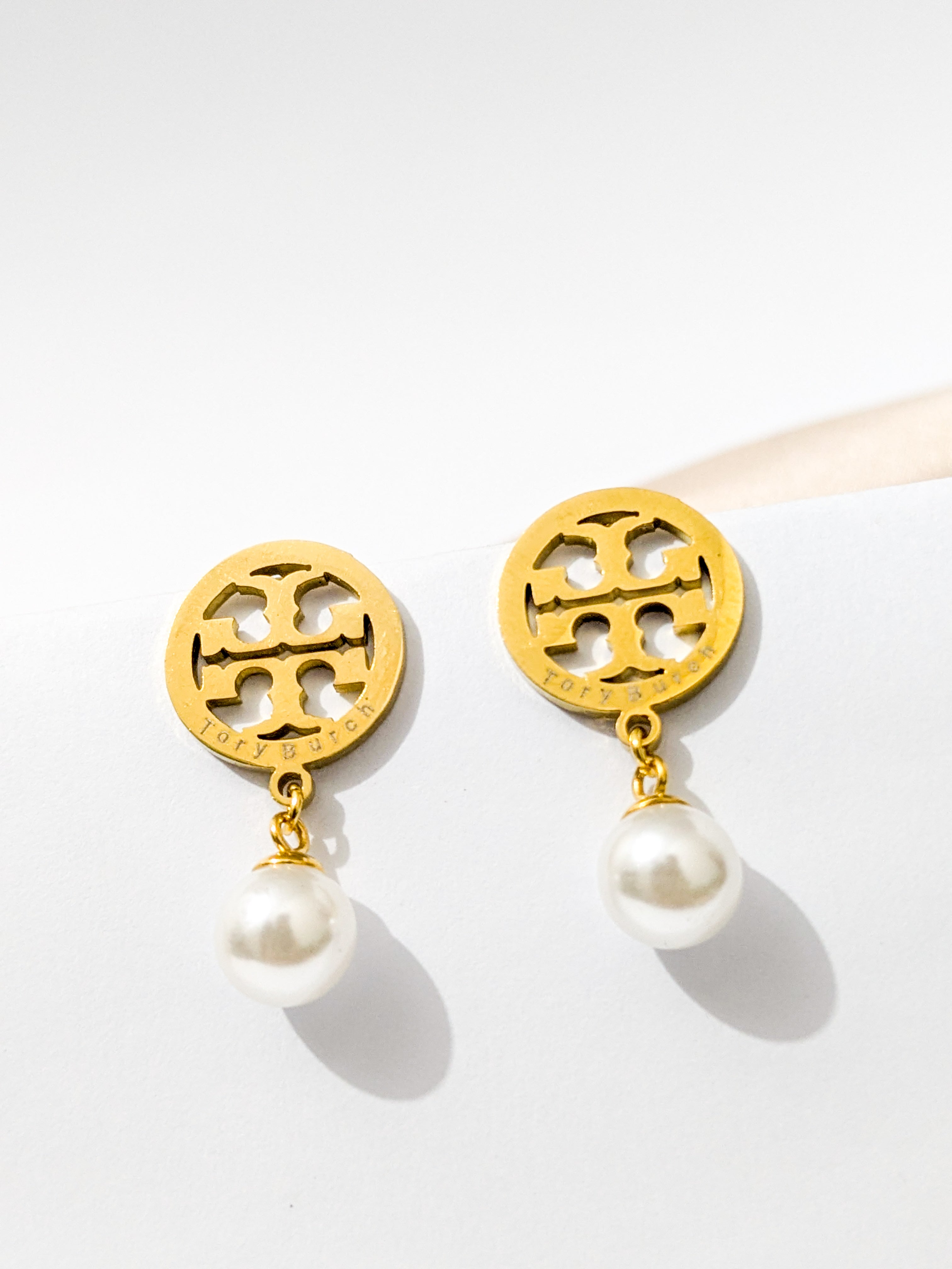A Pair of Tory Burch pearl drop earrings