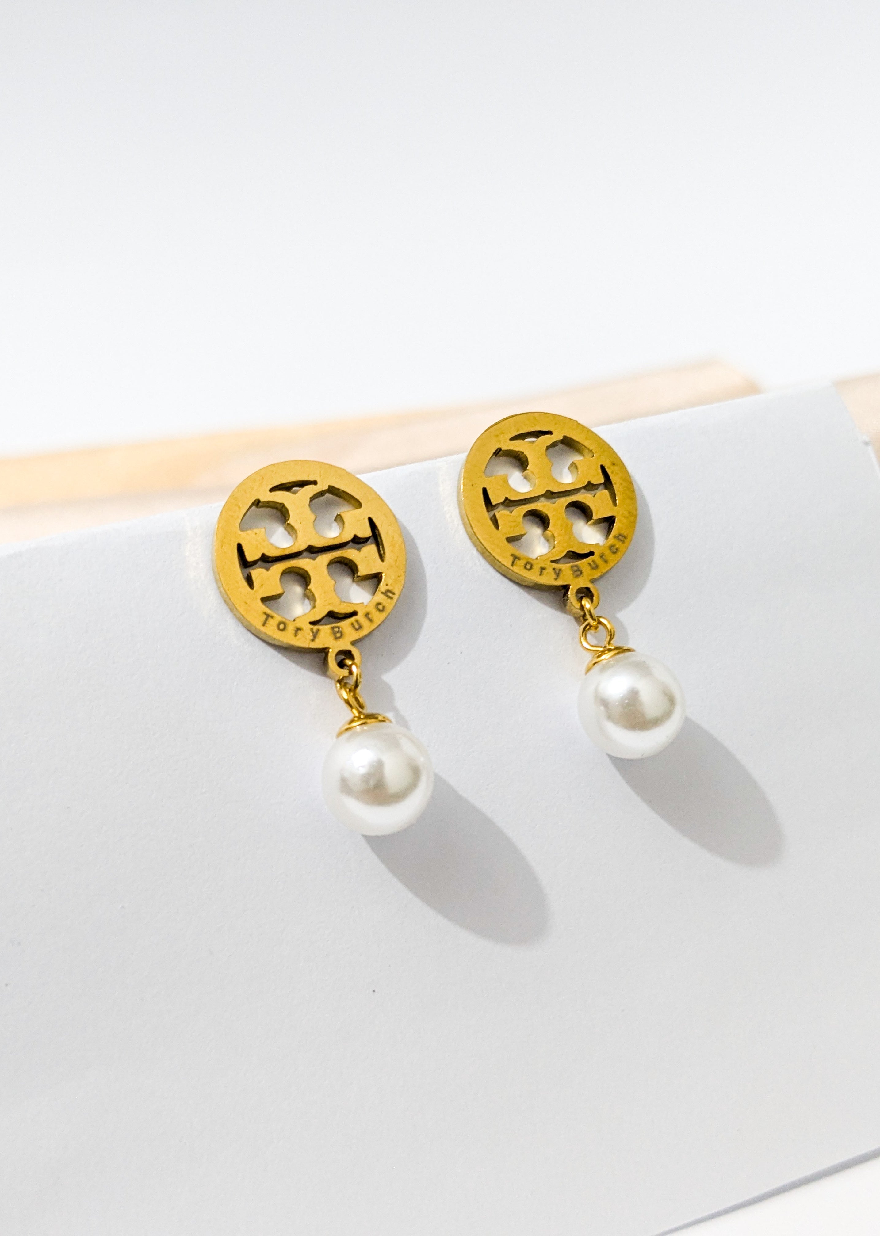 A Pair of Tory Burch pearl drop earrings