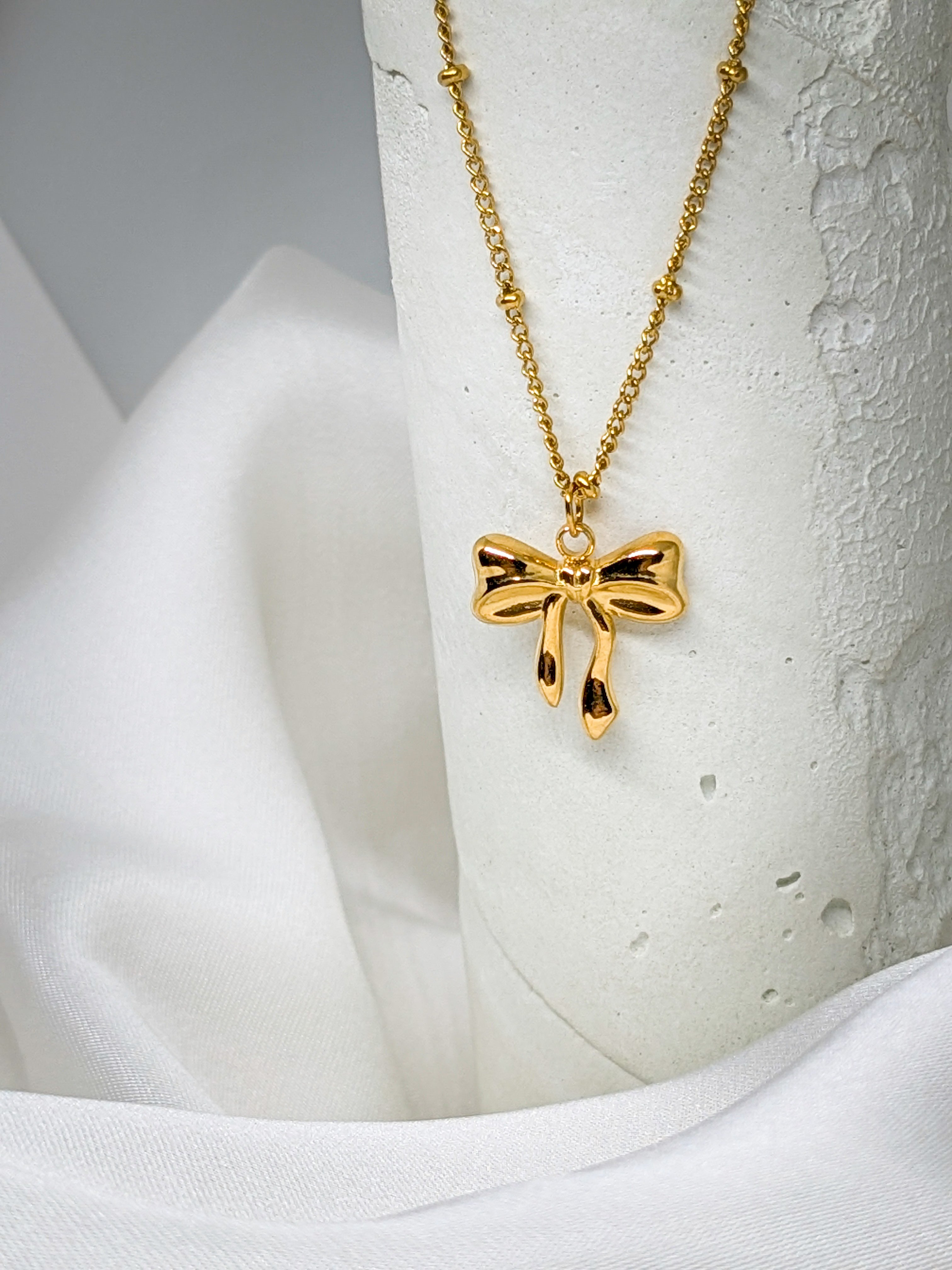Elegant Gold Bow Pendant Necklace