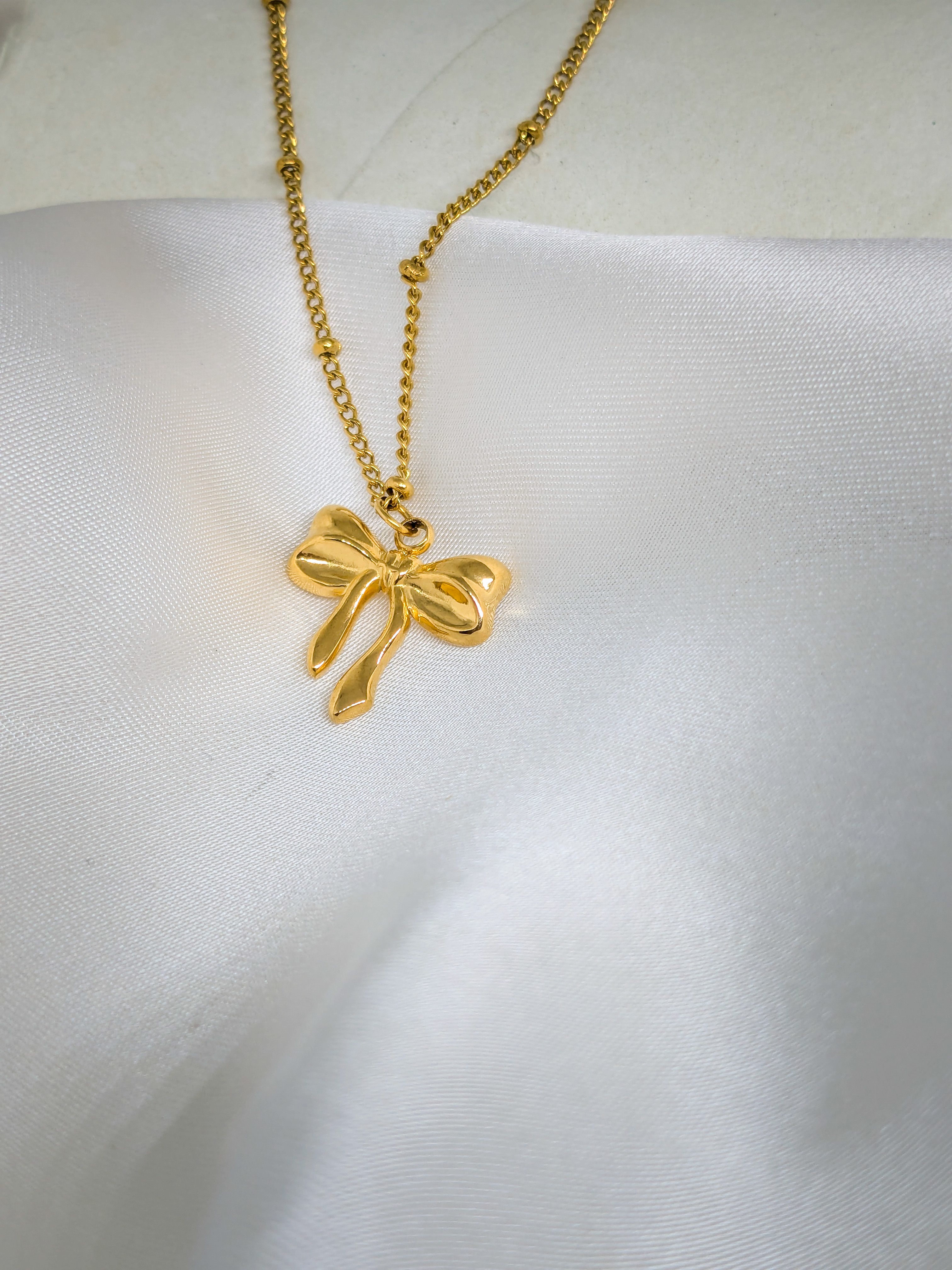 Elegant Gold Bow Pendant Necklace