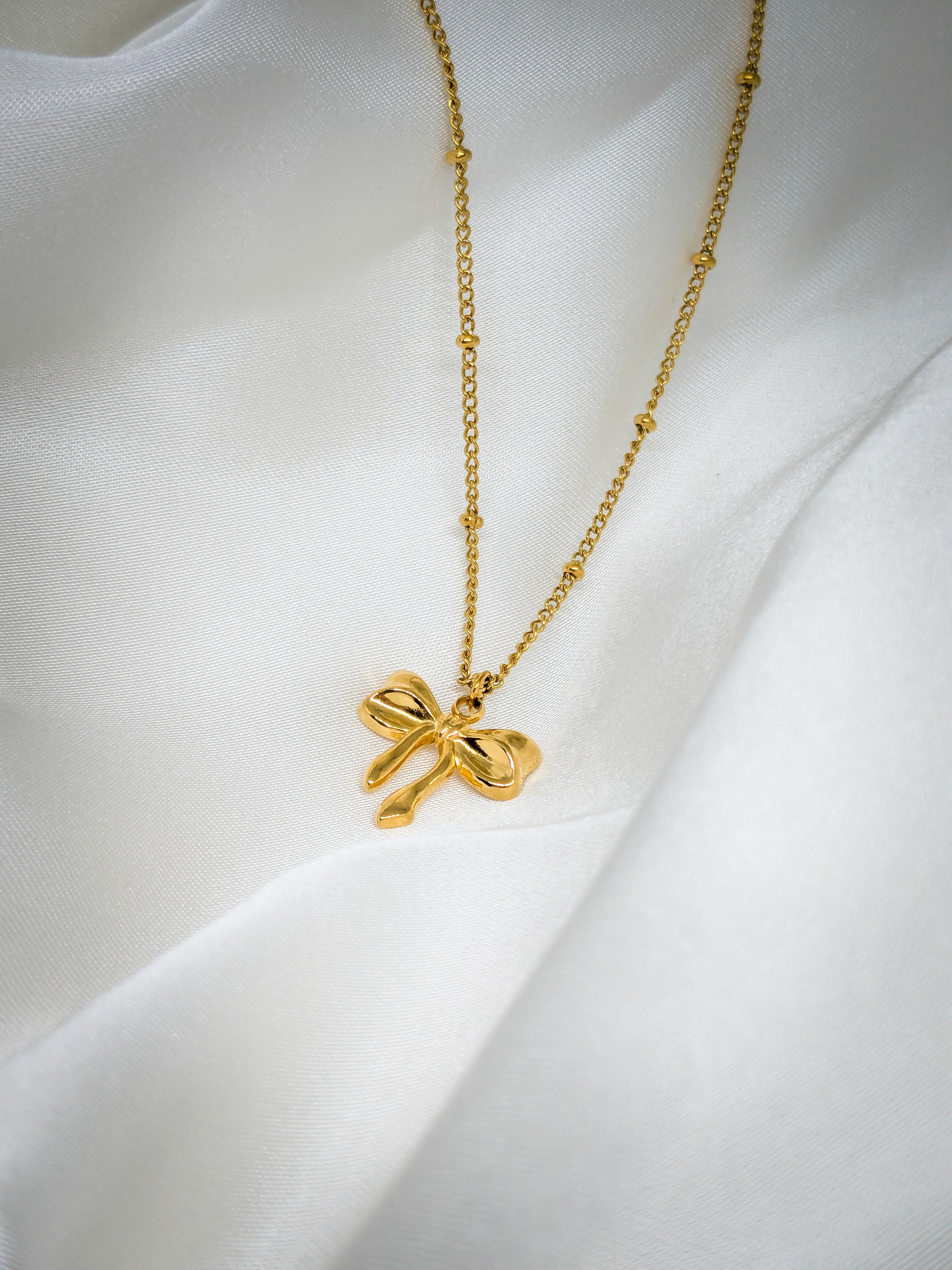 Elegant Gold Bow Pendant Necklace