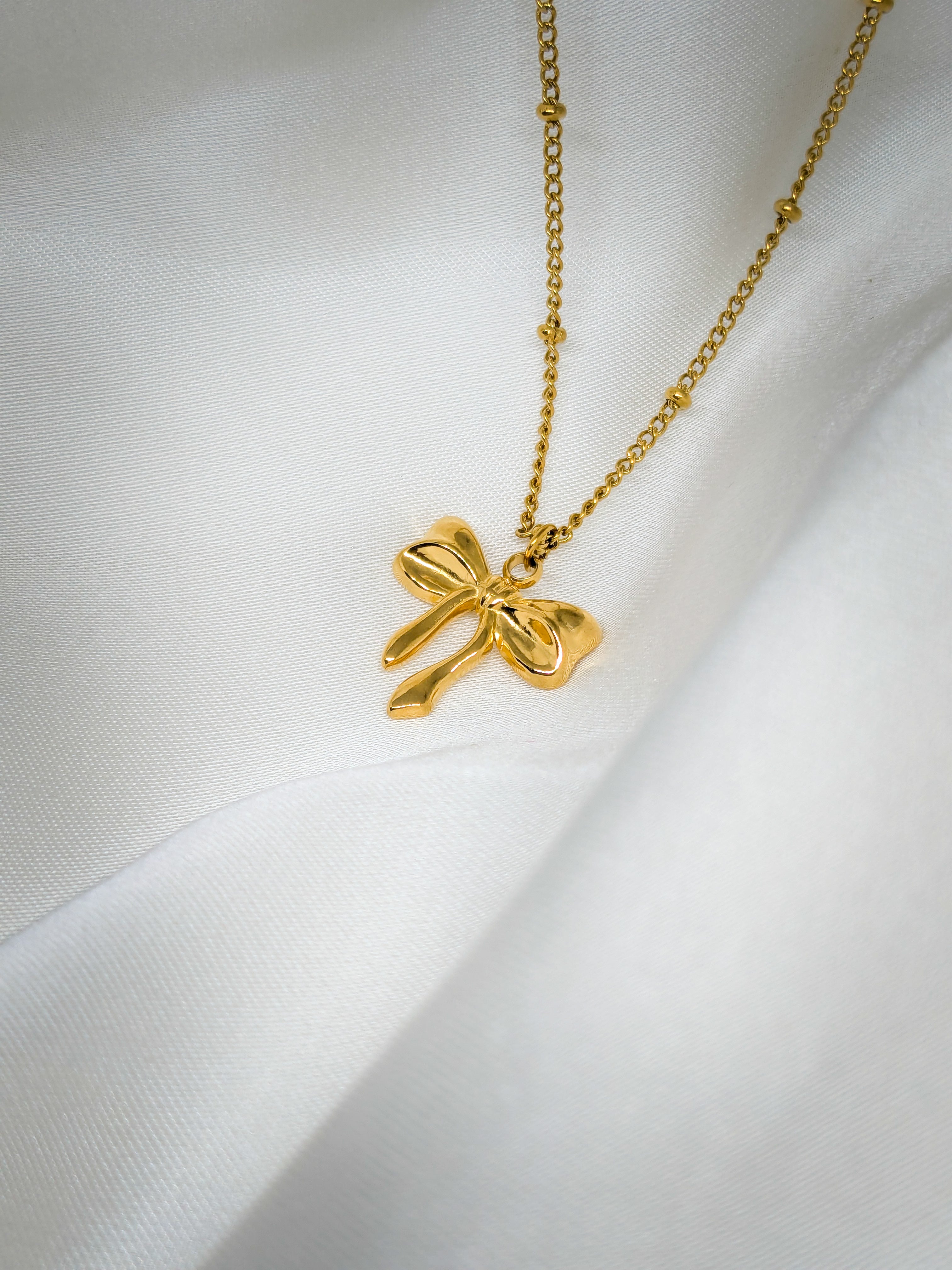 Elegant Gold Bow Pendant Necklace