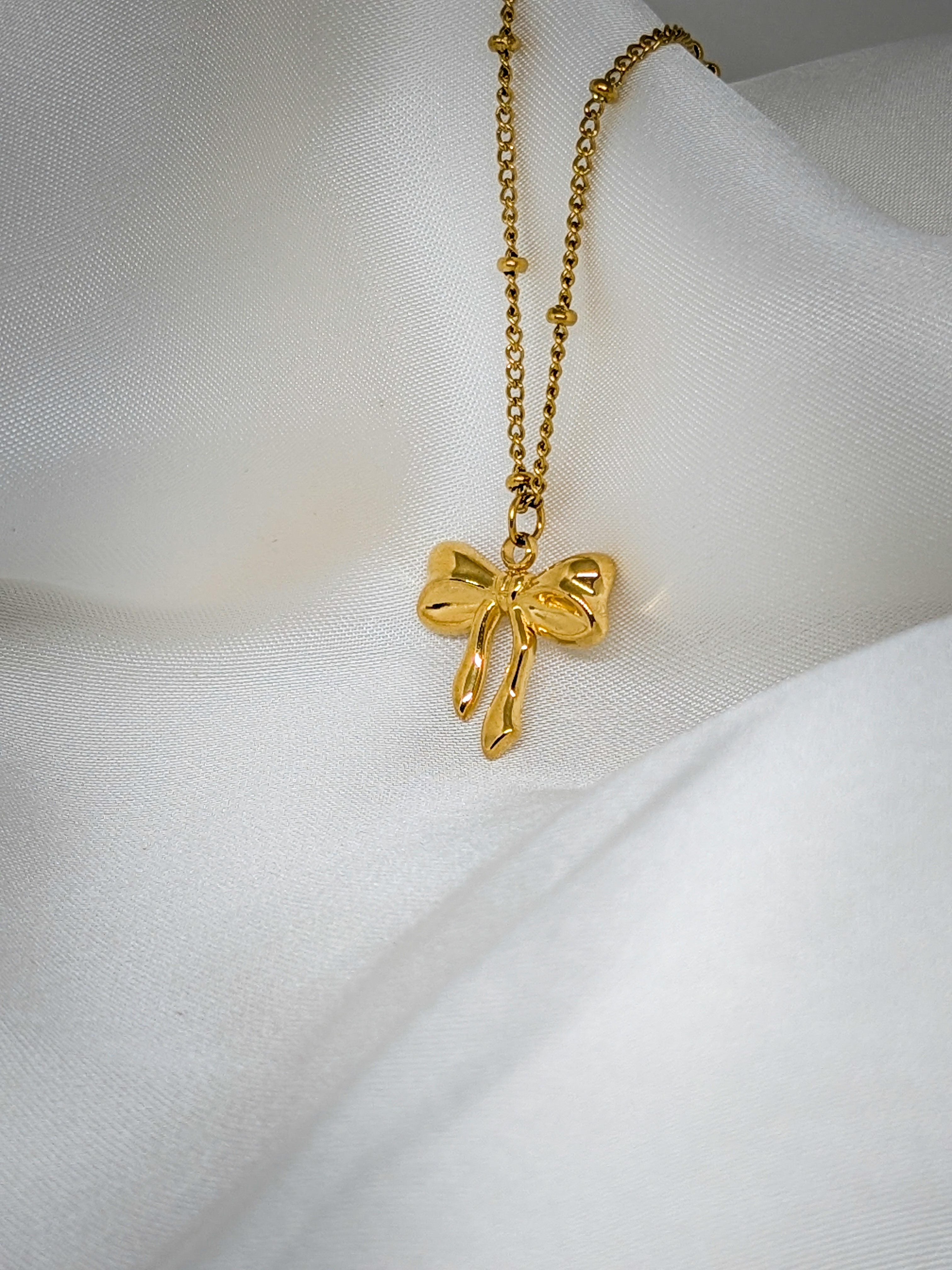 Elegant Gold Bow Pendant Necklace
