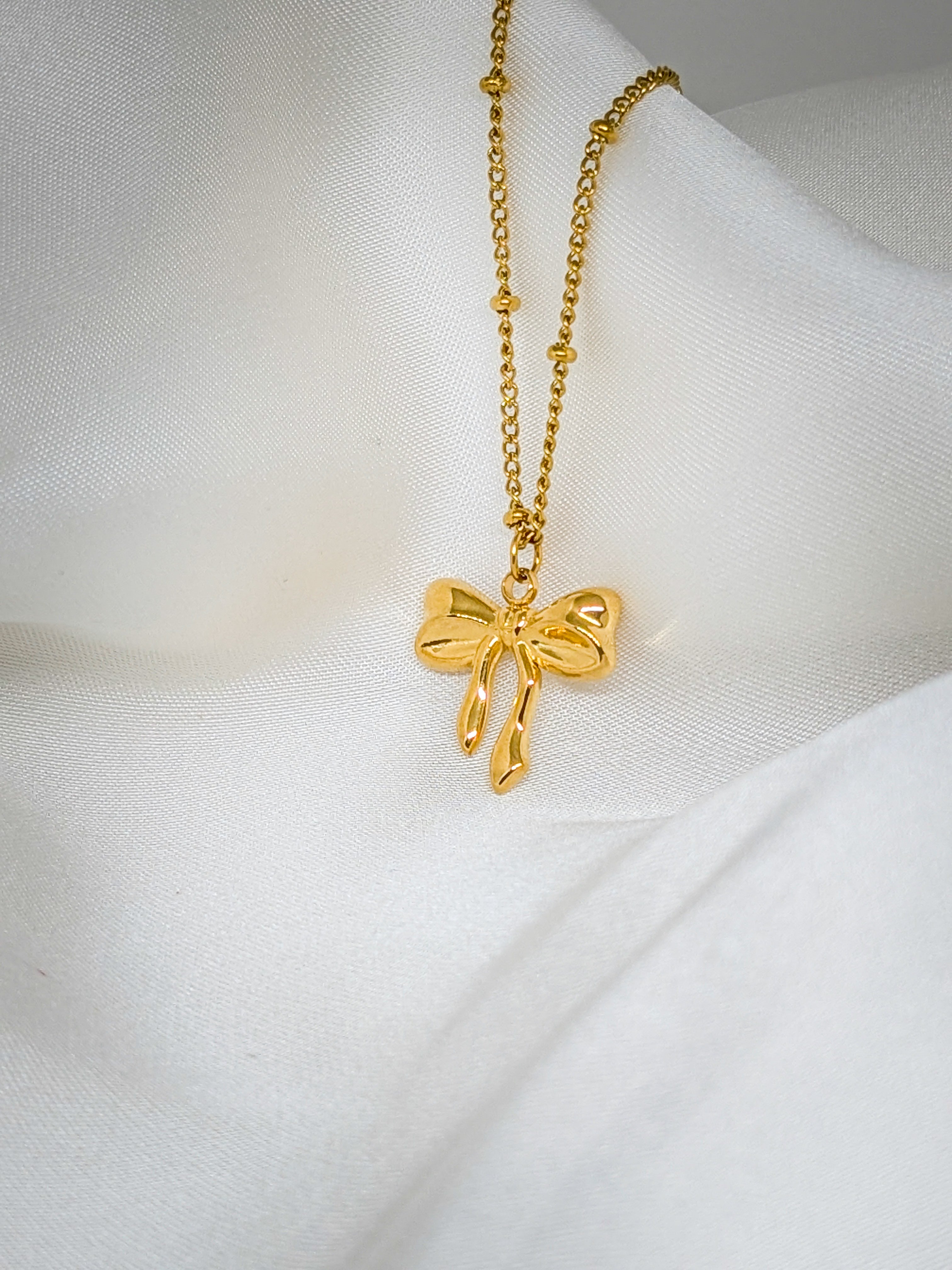 Elegant Gold Bow Pendant Necklace